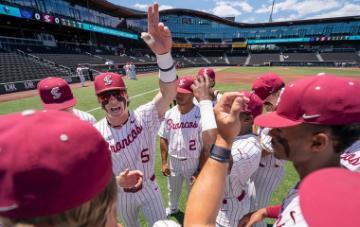 Santa Clara baseball players huddle up before a game against Portland 