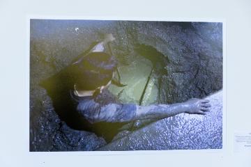 man in digging a hole in the ground