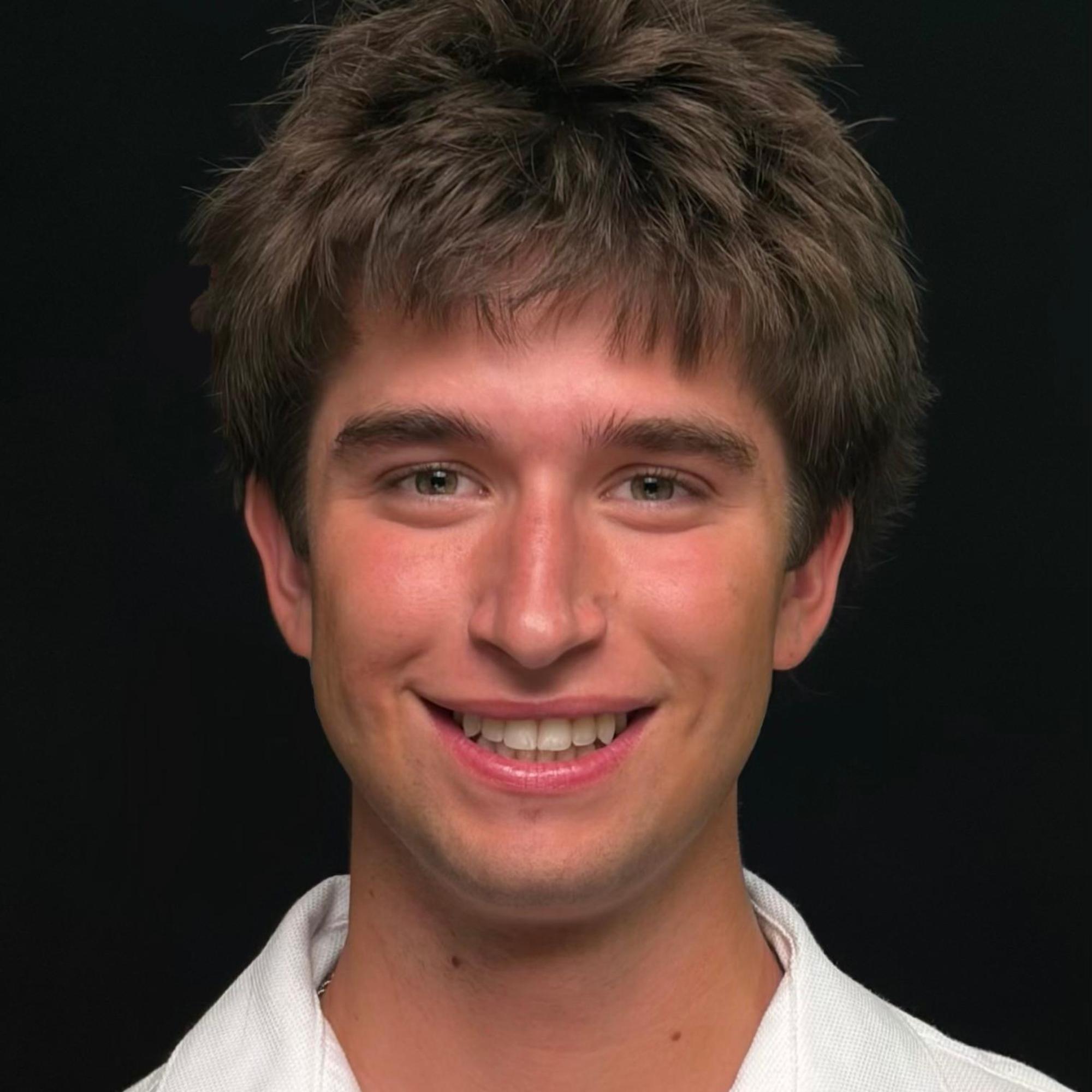A headshot photo of Miles