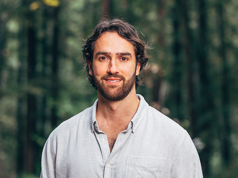Sean Reilly headshot with forest background