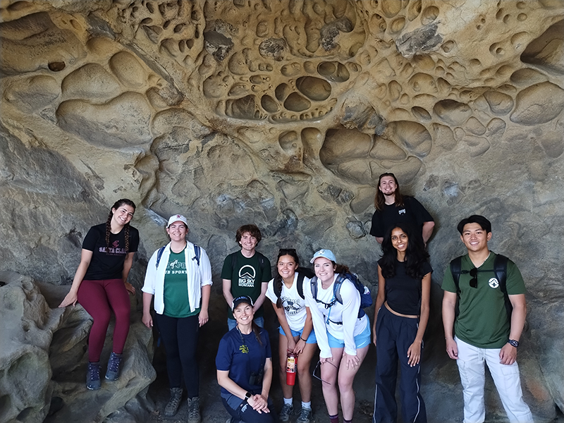 Students in front of a rock formation at Castle Rock State Park