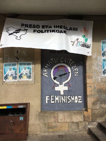 Banner with text Ni la tierra ni las mujeres somos territorio de conquista.