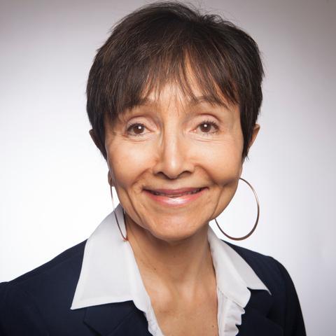 A woman smiling in a professional headshot.