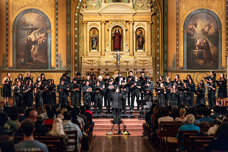 Concert choir performing in Mission Santa Clara