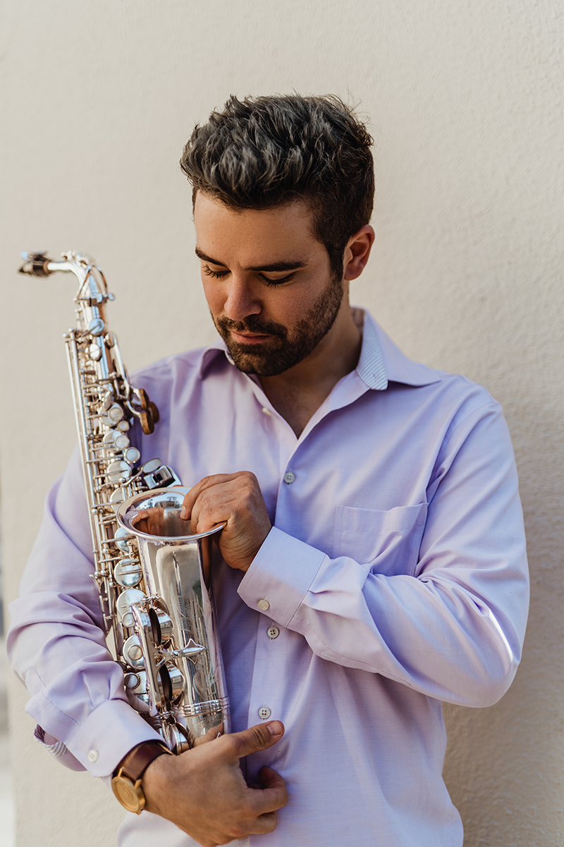 Isaac Raven with saxophone
