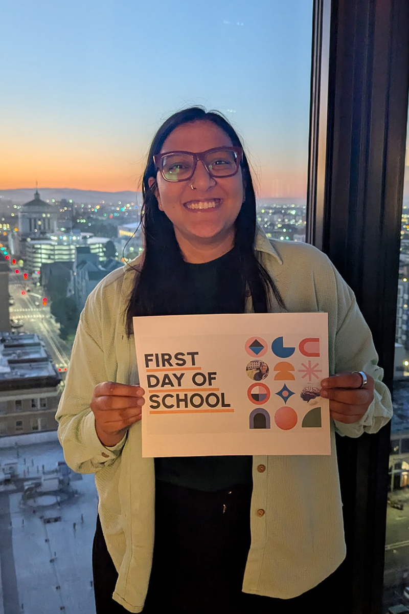 Tanya Gupta holding a note saying First Day of School