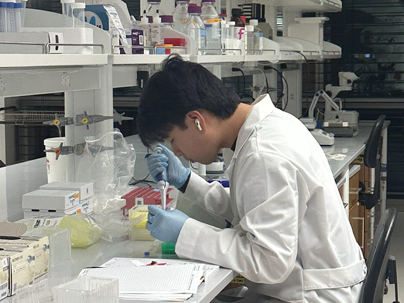 Colin Smith conducting research in a lab