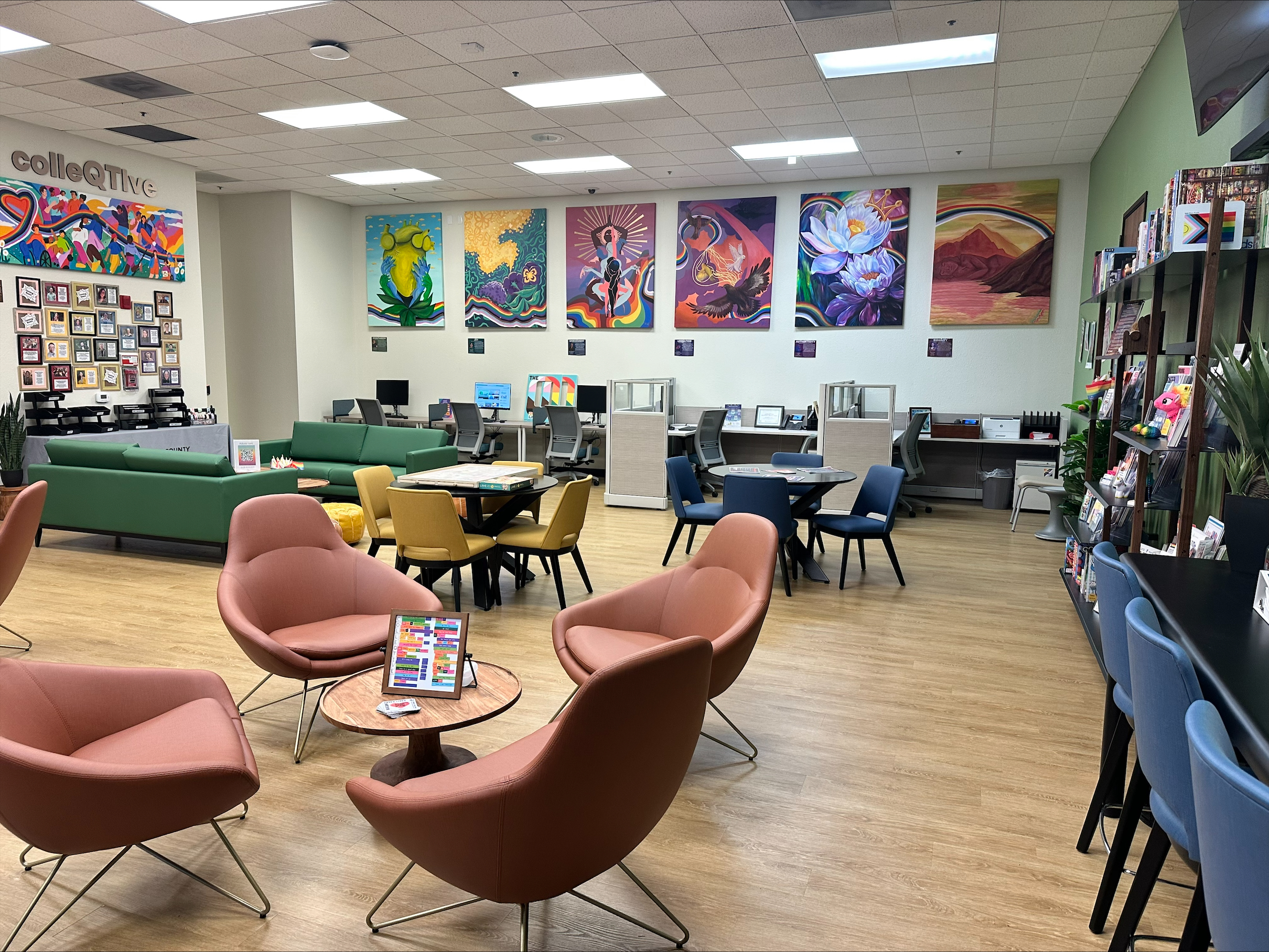 With the intention of curating a warm, colorful space so everyone who walks in feels welcome, the clinic worked with local queer and trans artists to create artistic representations of the clinics values, including liberation, community, and joy. The art series is shown here on the walls of the clinic lobby.