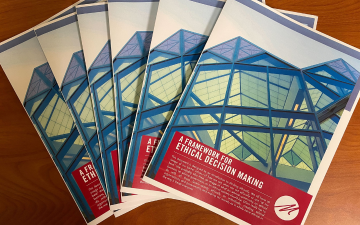Flyers fanned out on a table. Framework for Ethical Decision Making Markkula Center for Applied Ethics