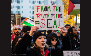 A protester carries a sign that reads, From the river to the sea. at a Pro-Palistinian rally in Columbus Ohio. Photo by Paul Becker/Becker1999 via Wikipedia and reused under Creative Commons license CC BY-2.0..