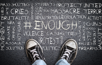 Person standing on chalkboard with words Ethical storytelling and other phrases.