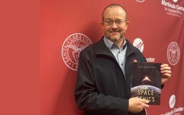 Brian Patrick Green displays his new book, Space Ethics.