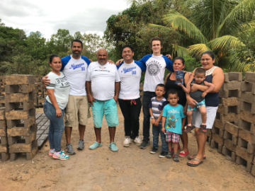 Mr. Allan Baez-Morales of the Frugal Innovation Hub, my colleague, and me with the owner of the social entrepreneurship and his family in March, 2018. 