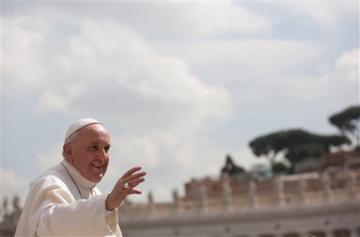 The Pope giving a blessing in an outdoor setting.