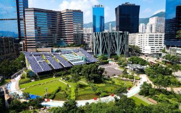 A structure with solar panels in the city. 