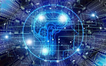human brain overlayed with computer motherboard 