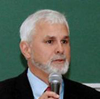 An individual speaking into a microphone.