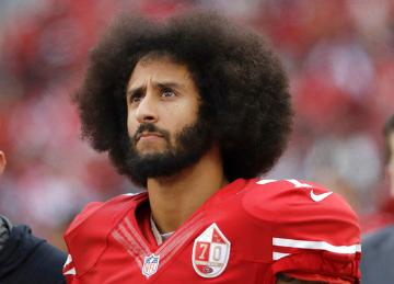 San Francisco 49ers quarterback Colin Kaepernick stands in the bench area during the second half of the teams NFL football game against the New York Jets in Santa Clara, Calif. Kaepernick told CBS he’ll stand during the national anthem if given chance to play football in NFL again. (AP Photo/Marcio Jose Sanchez, File)