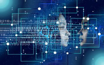 Digital illustration representing Artificial Intelligence, featuring a human profile facing a digital, translucent face made of circuit lines, overlaid with binary code and interconnected nodes on a dark blue background. 