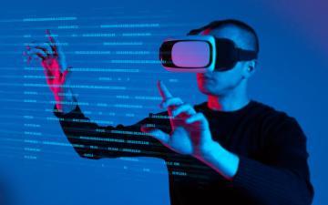 Man using VR Headset with virtual screen. Photo by High Stock via Adobe Stock.