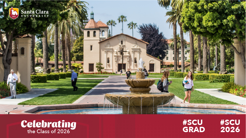 Celebrating the Class of 2026 banner under the Mission of Santa Clara church behind a water fountain.