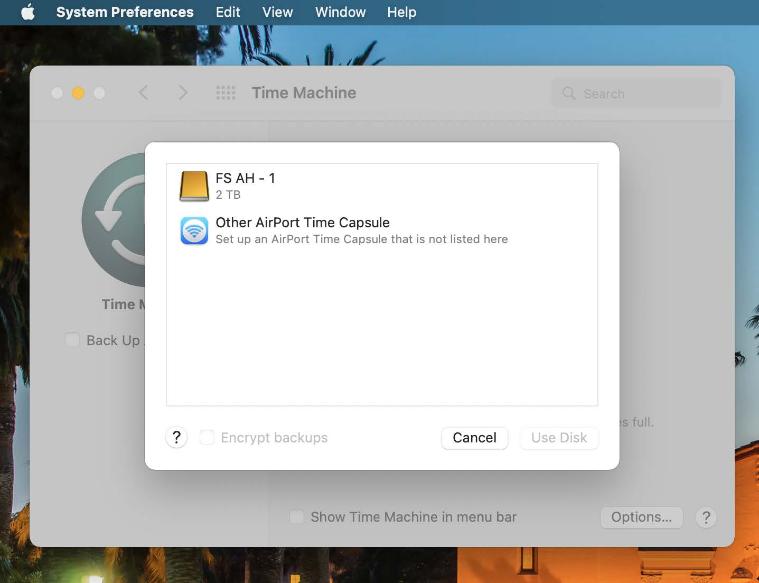 An image of the Time Machine panel showing a selection list to choose a backup location. List includes FS AH - 1 external hard drive and Other AirPort Time Capsule.