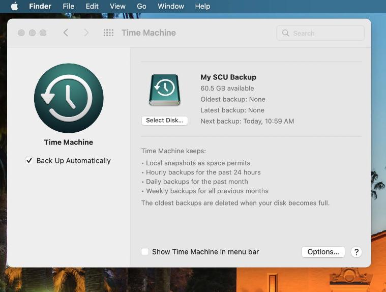 An image of the Time Machine panel in System Preferences showing an external drive My SCU Backup as the backup drive with the option checked to Back Up Automatically.