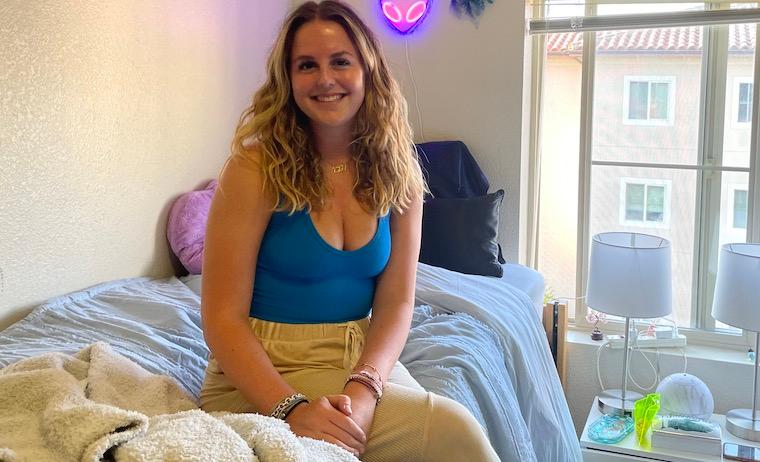 Charlie Johnson 26 in her dorm room at Casa Italiana Apartments.