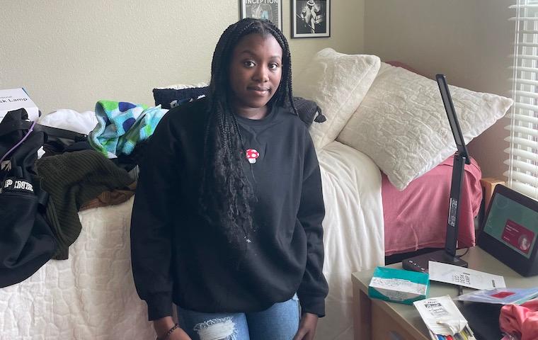 MacKenzie Fisher 26 takes a break during her move-in day at Graham Residence Hall.