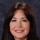 Portrait of a smiling woman named Christine Zanello.