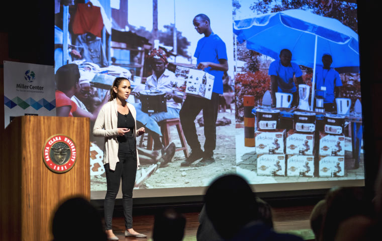 A woman on stage at the GSBI investor showcase 2016