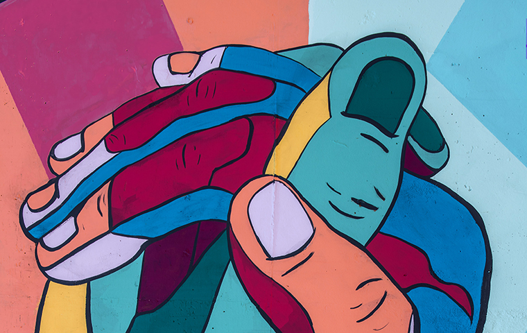 A painting of two hands coming together