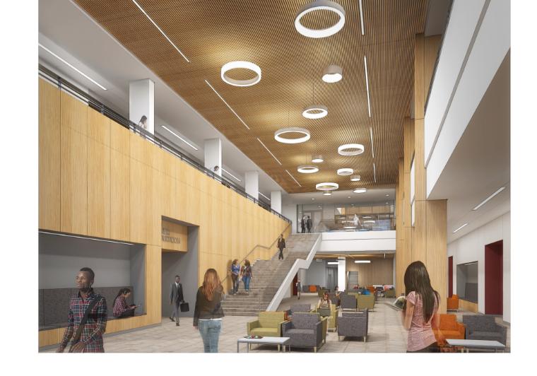 Modern classroom with staircase, study areas, and overhead lighting, titled Charney Classroom Court. image link to story
