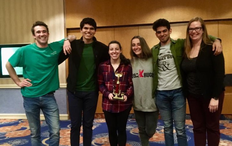 SCUs five ethics bowl team members plus coach posing in a hotel in Atlanta