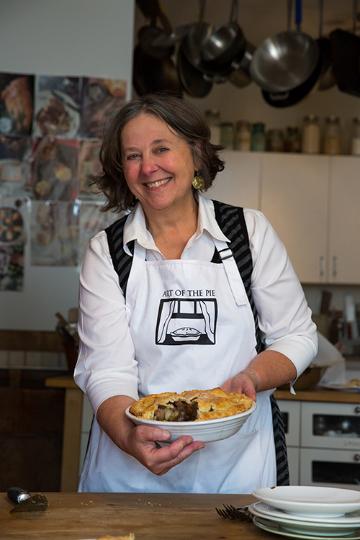 Kate McDermott holds a pie in her kitchen