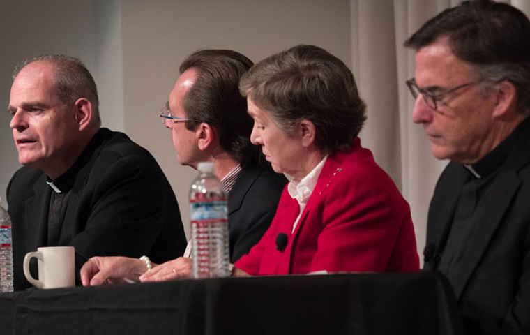 Fr. Brendan McGuire, left, speaks during an Oct. 9 panel discussion at Santa Clara University. Other panelists included, from left: Thomas Plante; Sally Vance-Trembath; and Jesuit Fr. Kevin OBrien.