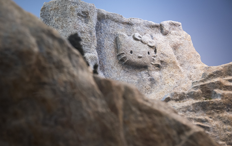 Hello Kittys face carved into the side of a mountain image link to story