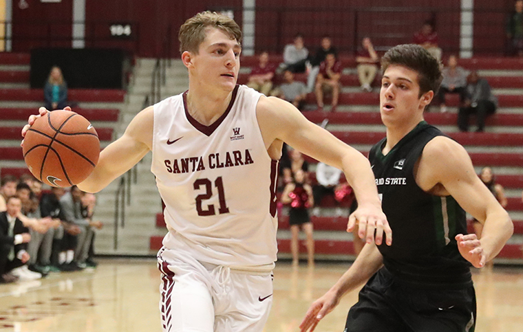 Henry Caruso 18 drives to the basket