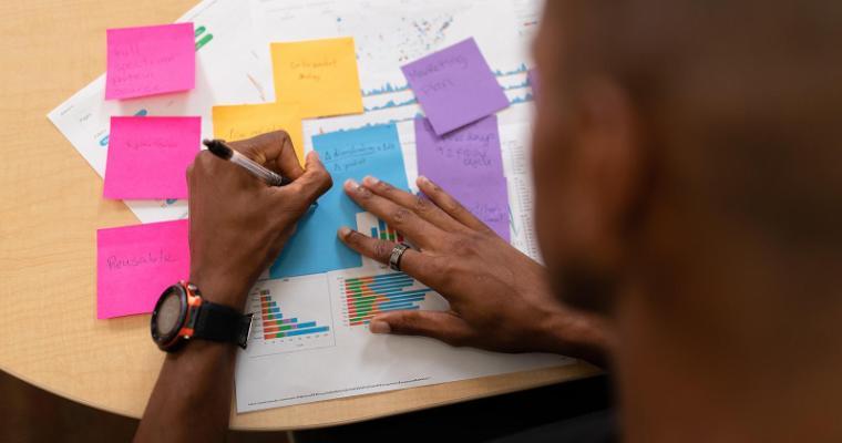 Student studying with bright colored note cards