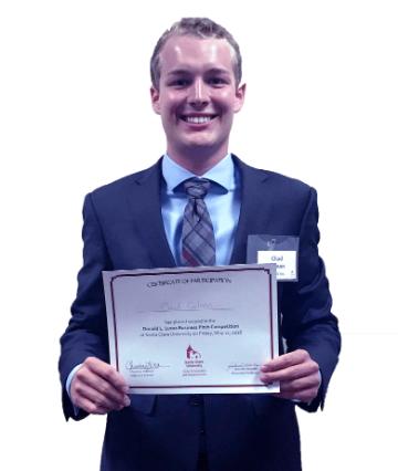 Man in suit holding Second Place business pitch award certificate.