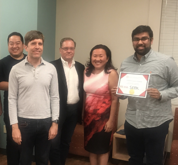 Group of five posing; one holds certificate labeled 2019 Third Place Winners.