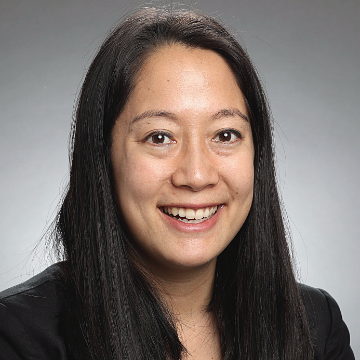 A woman smiling in a professional headshot.