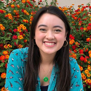 Woman smiling in SCU orientation polo shirt