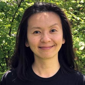 Person wearing a MIT shirt standing outdoors.