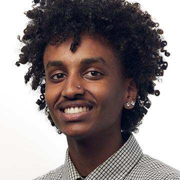 Man in gray shirt smiling