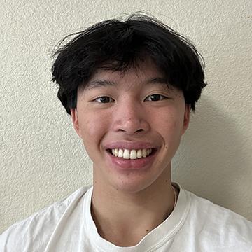 Man in white shirt smiling