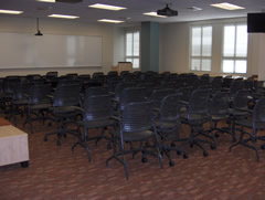 Room with chairs arranged in theater style setup.
