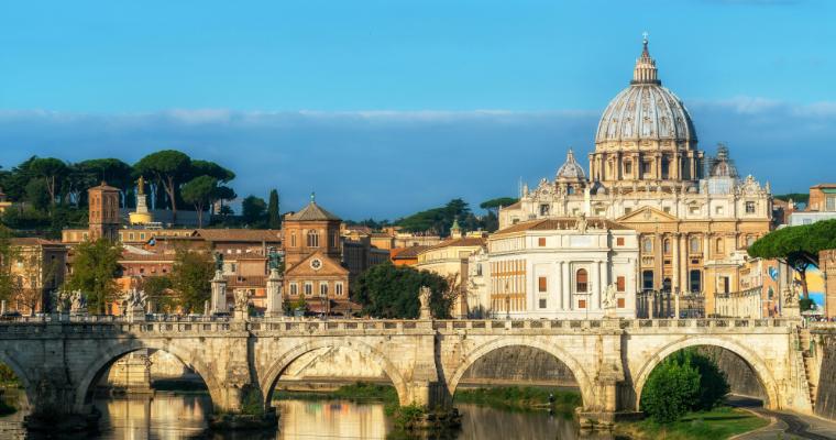Rome Skyline with Vatican St Peter Basilica of Vatican and St Angelo Bridge crossing Tiber River in the city center of Rome Italy. image link to article