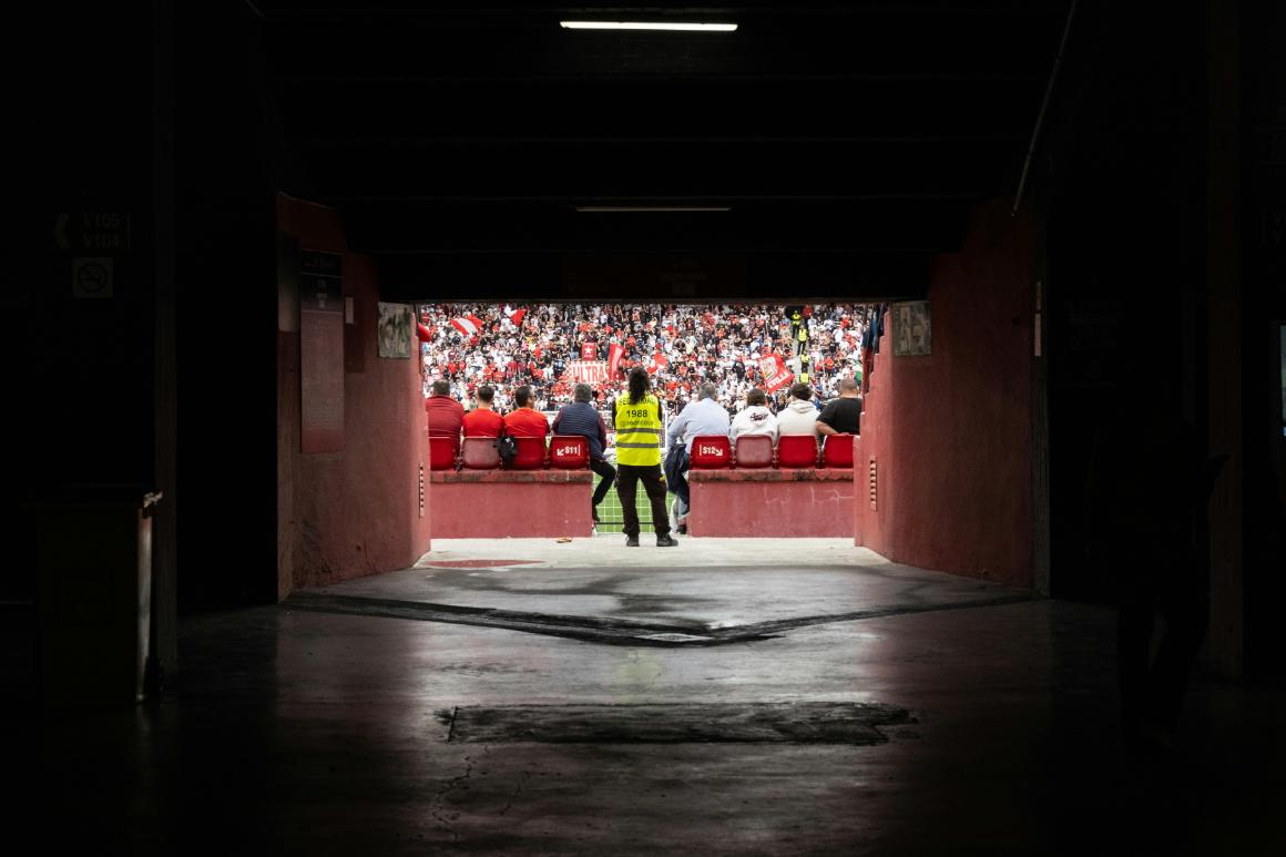 Security personnel through stadium tunnel