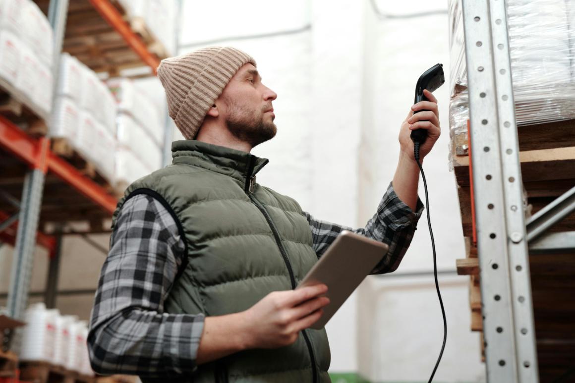 Employee scanning product for inventory